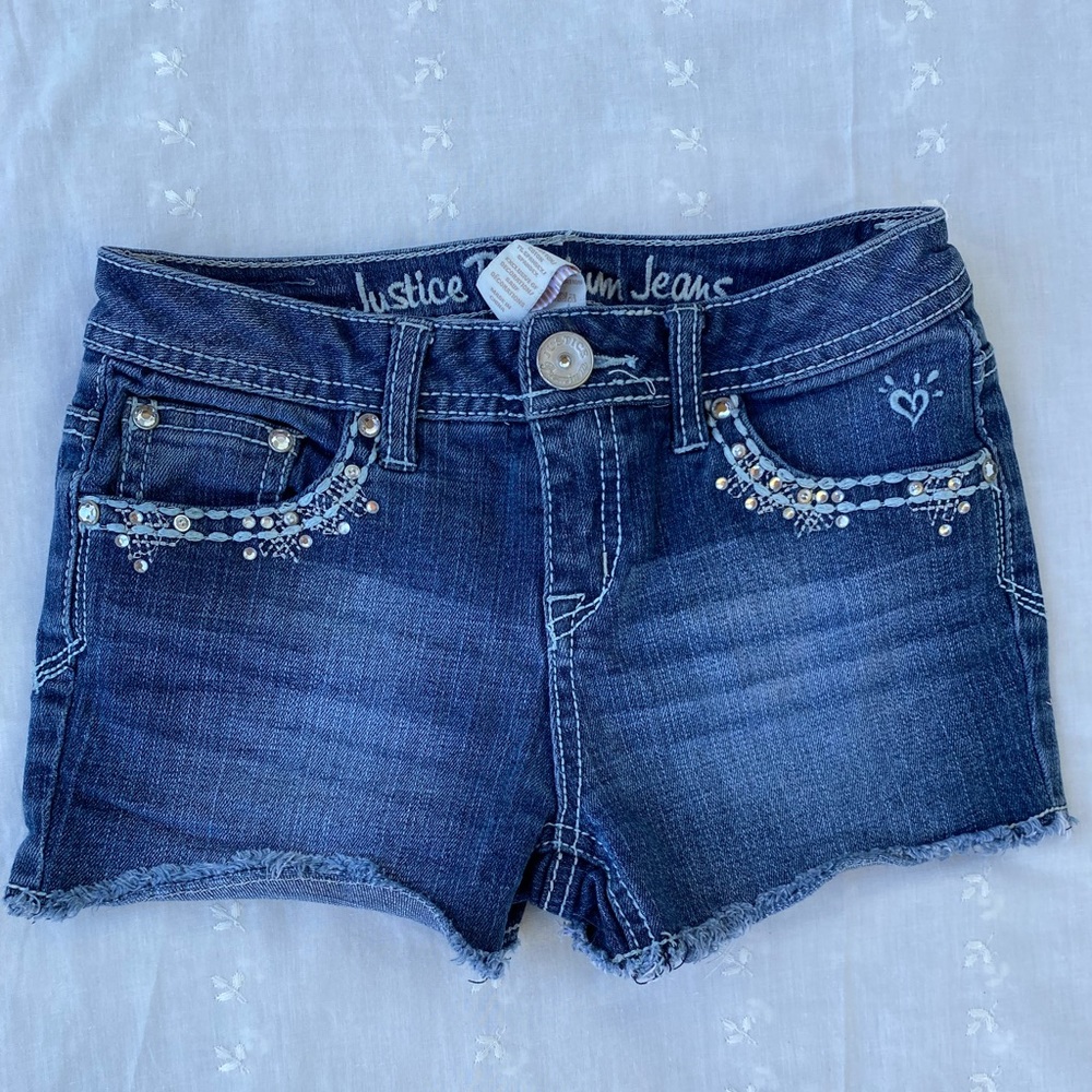Justice Jean shorts with sequins on front and back pockets.